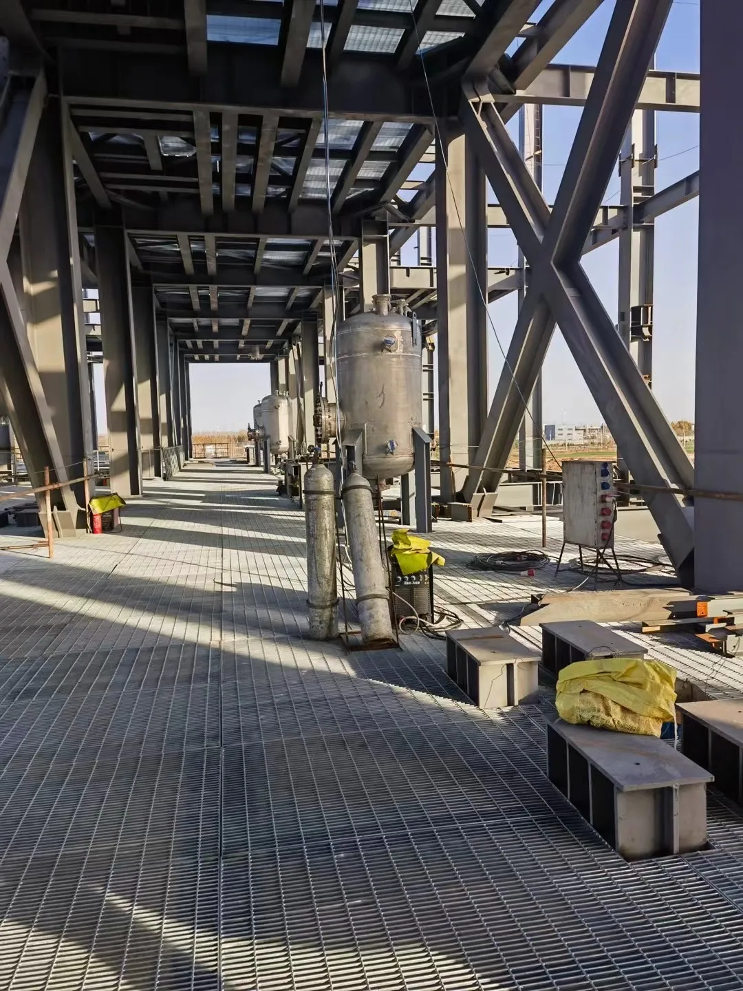 Steel grating platform and access walkway in a chemical processing plant