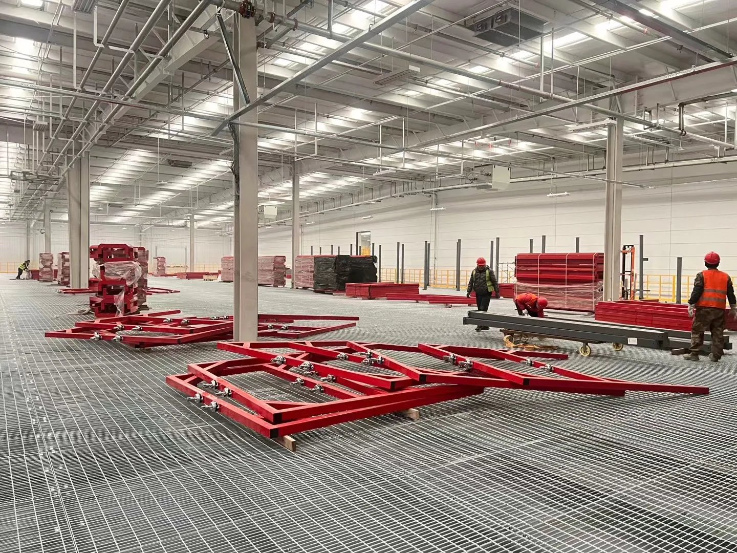 Large galvanized steel grating floor inside an industrial facility