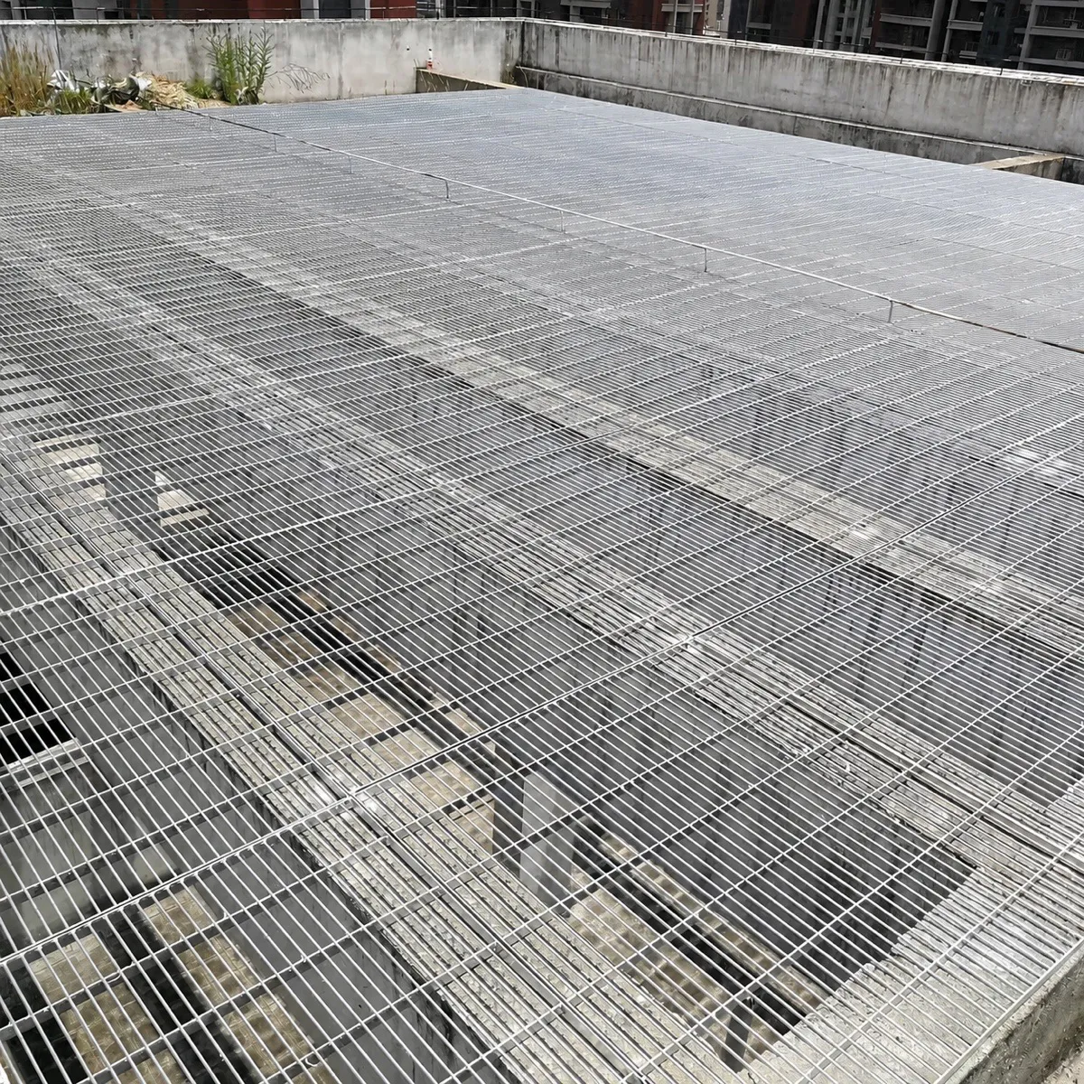 Large outdoor area covered with galvanized steel grating flooring