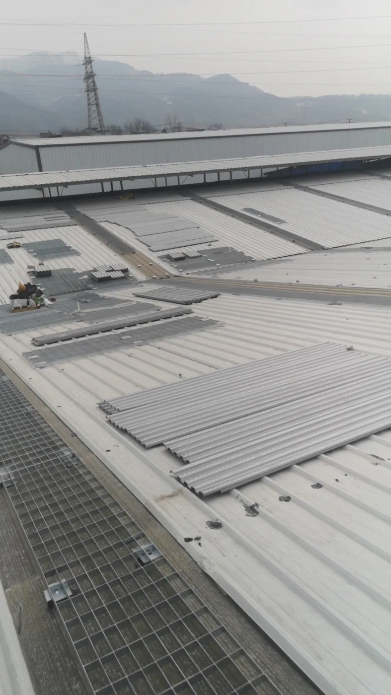 Steel grating solar-roof walkway during installation
