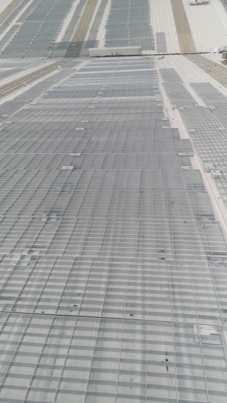 Large rooftop solar array served by steel grating maintenance walkways