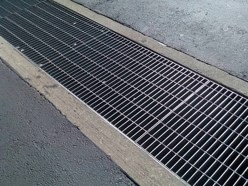 Galvanized steel grating covers installed over a drainage trench