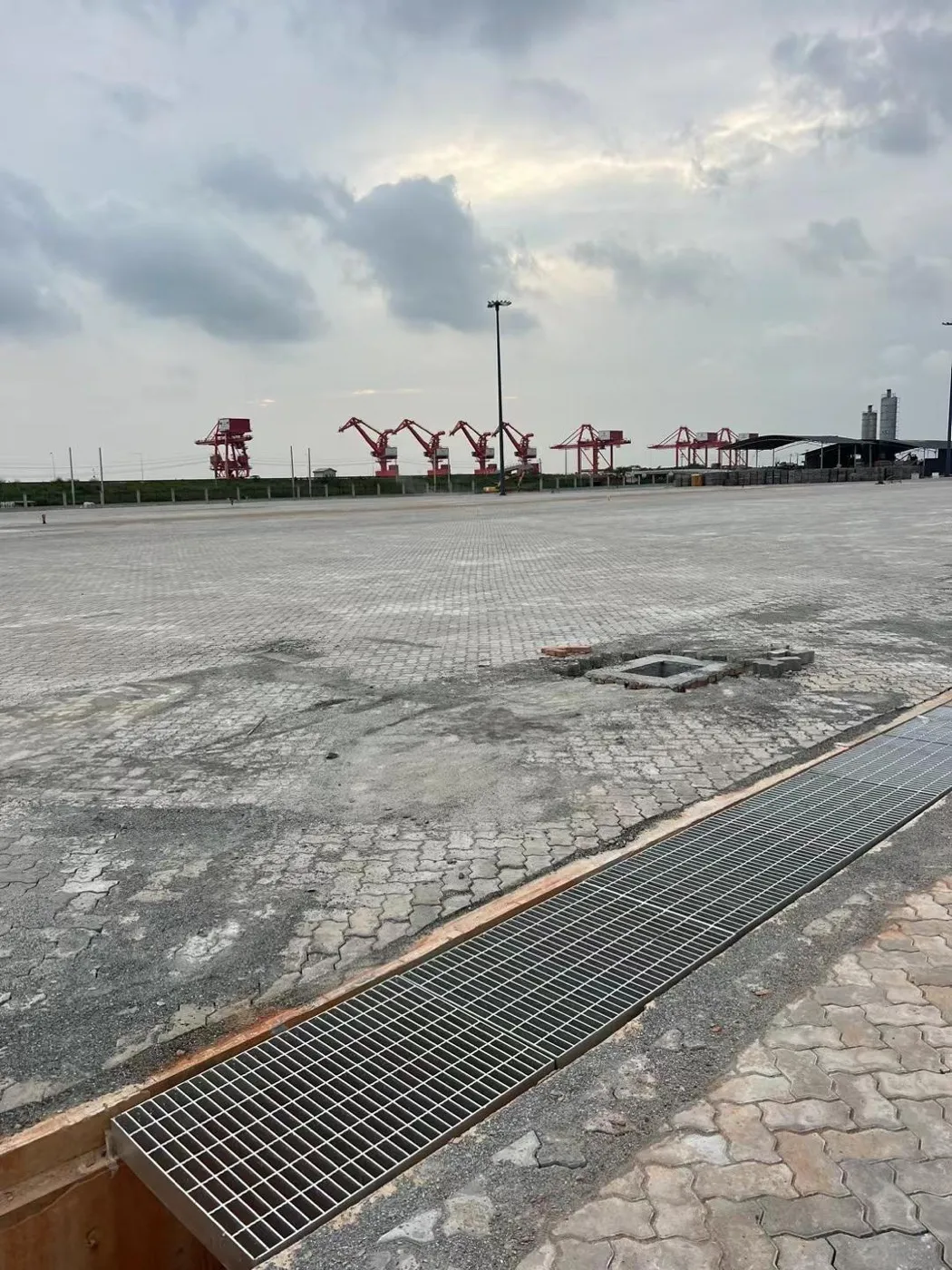 Steel grating trench covers across a large industrial site