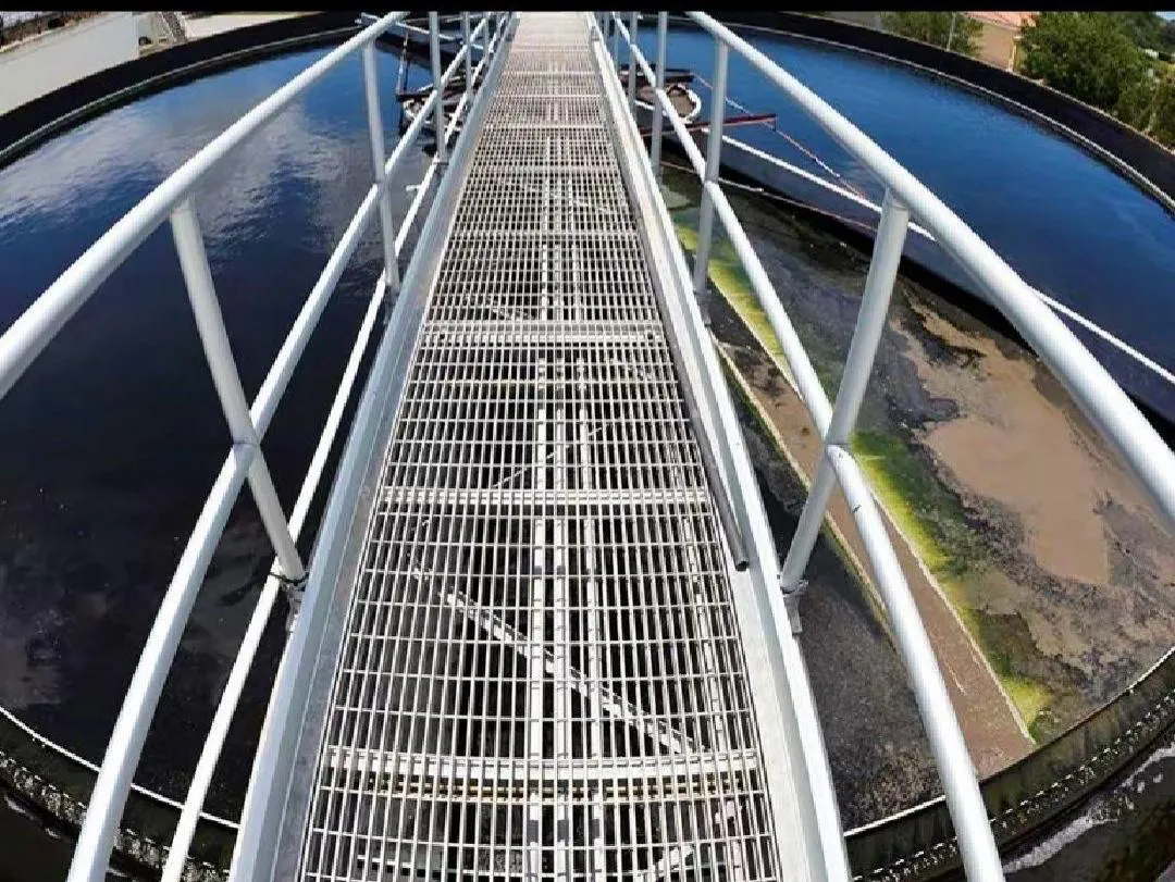 Circular steel grating walkway around water-treatment equipment