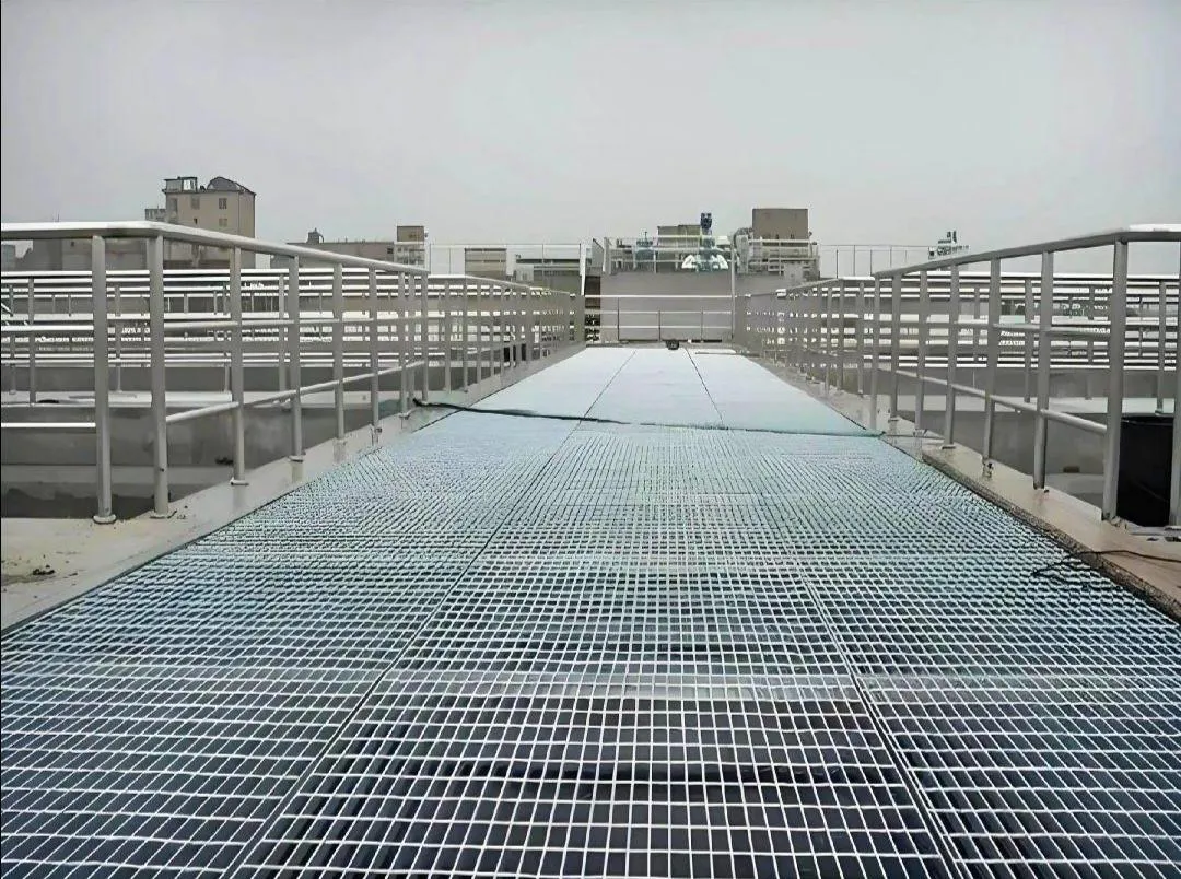 Steel grating maintenance walkway on a factory roof