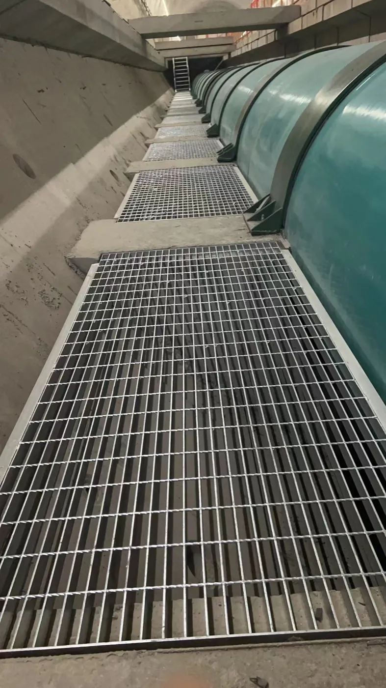 Steel grating maintenance walkway along a large pipeline