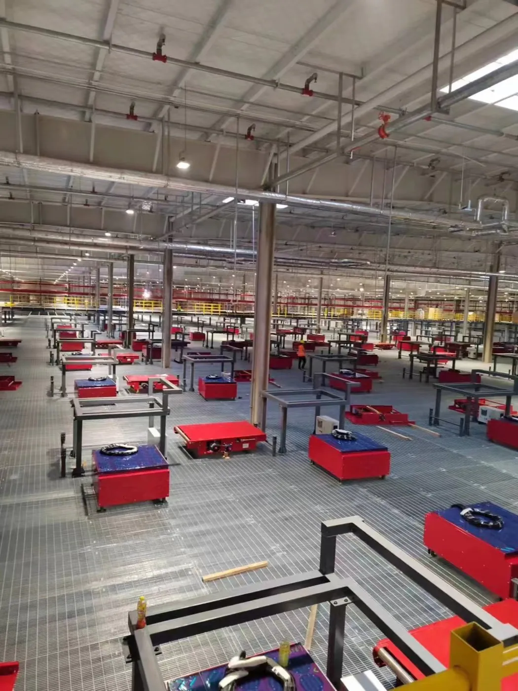 Steel grating platform installation around automated sorting equipment
