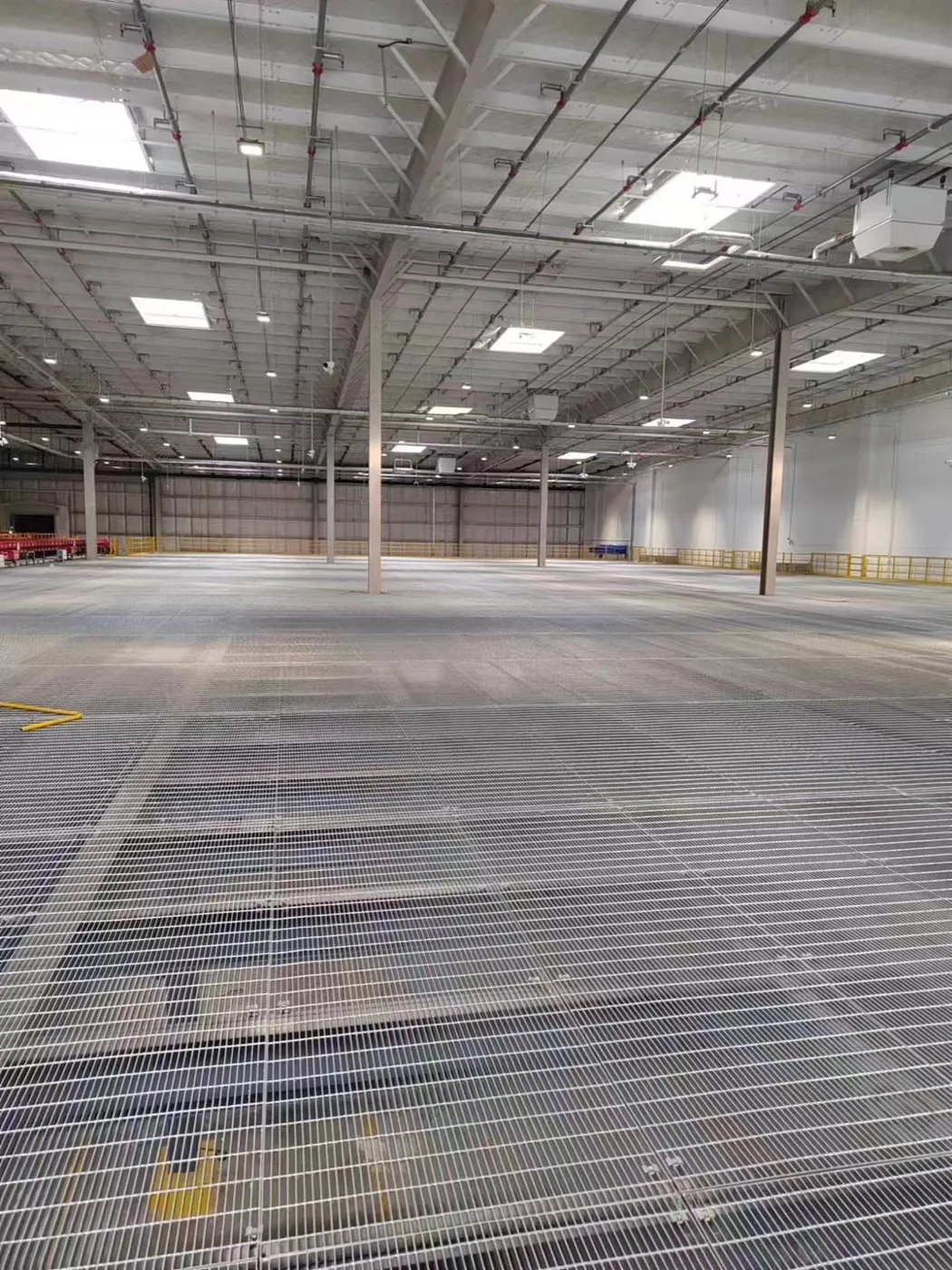 Large steel grating platform across an automated sorting center
