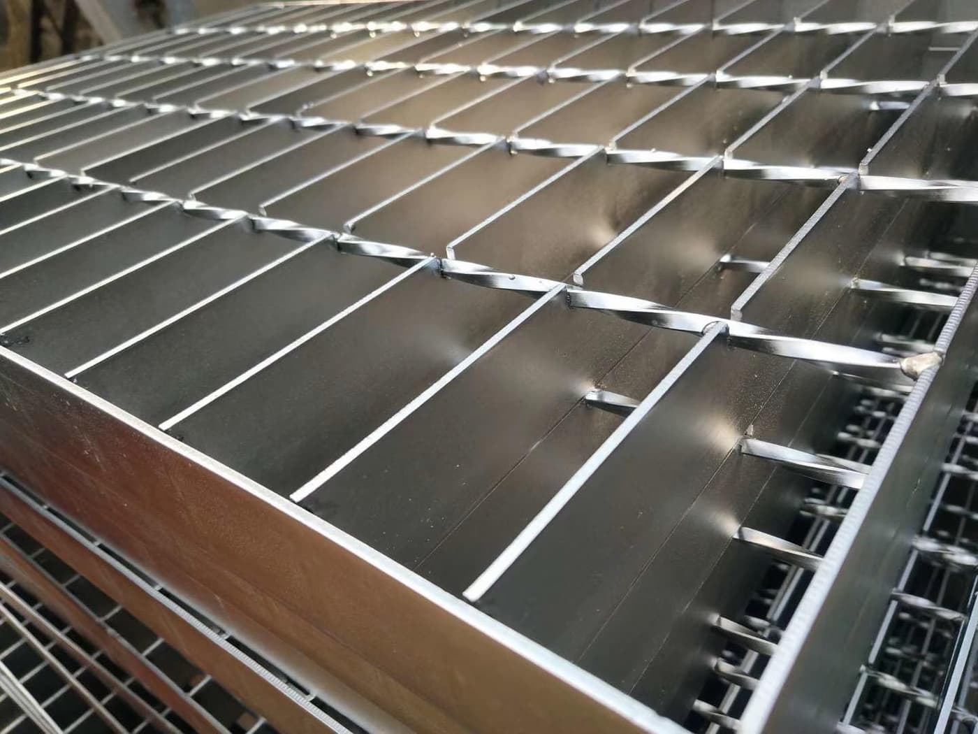 Close product view of clean stainless steel grating bars and intersections
