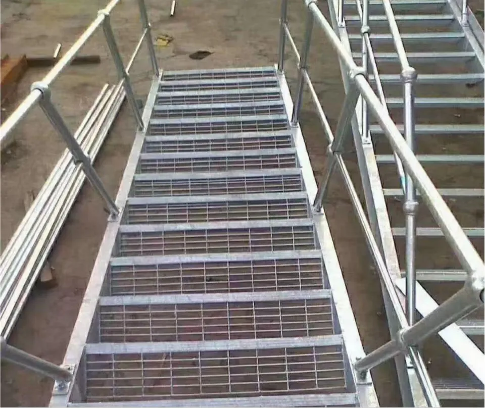 Assembled industrial staircase with grating stair treads and railings
