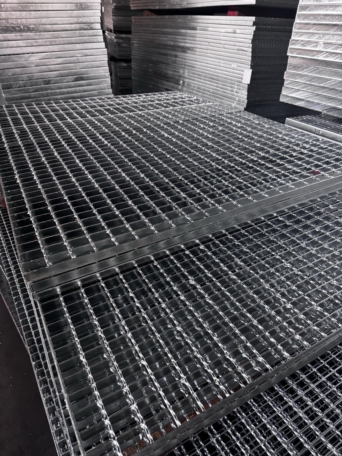 Galvanized steel grating walkway installed on an industrial platform
