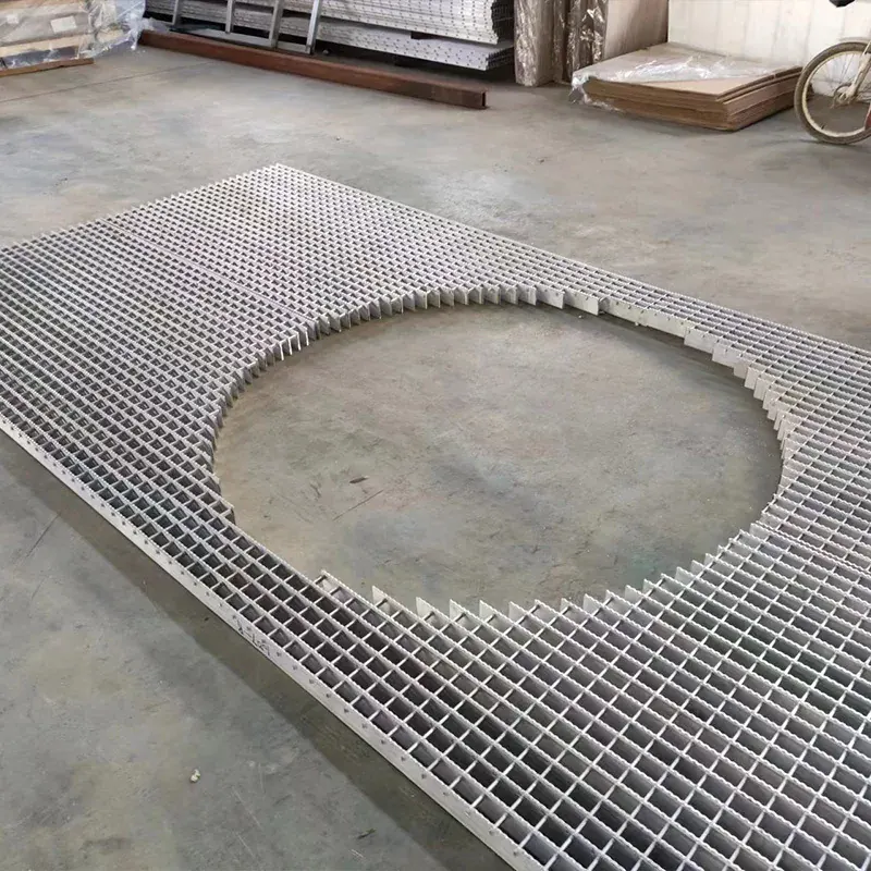 Custom aluminum grating panel fabricated around a large circular opening