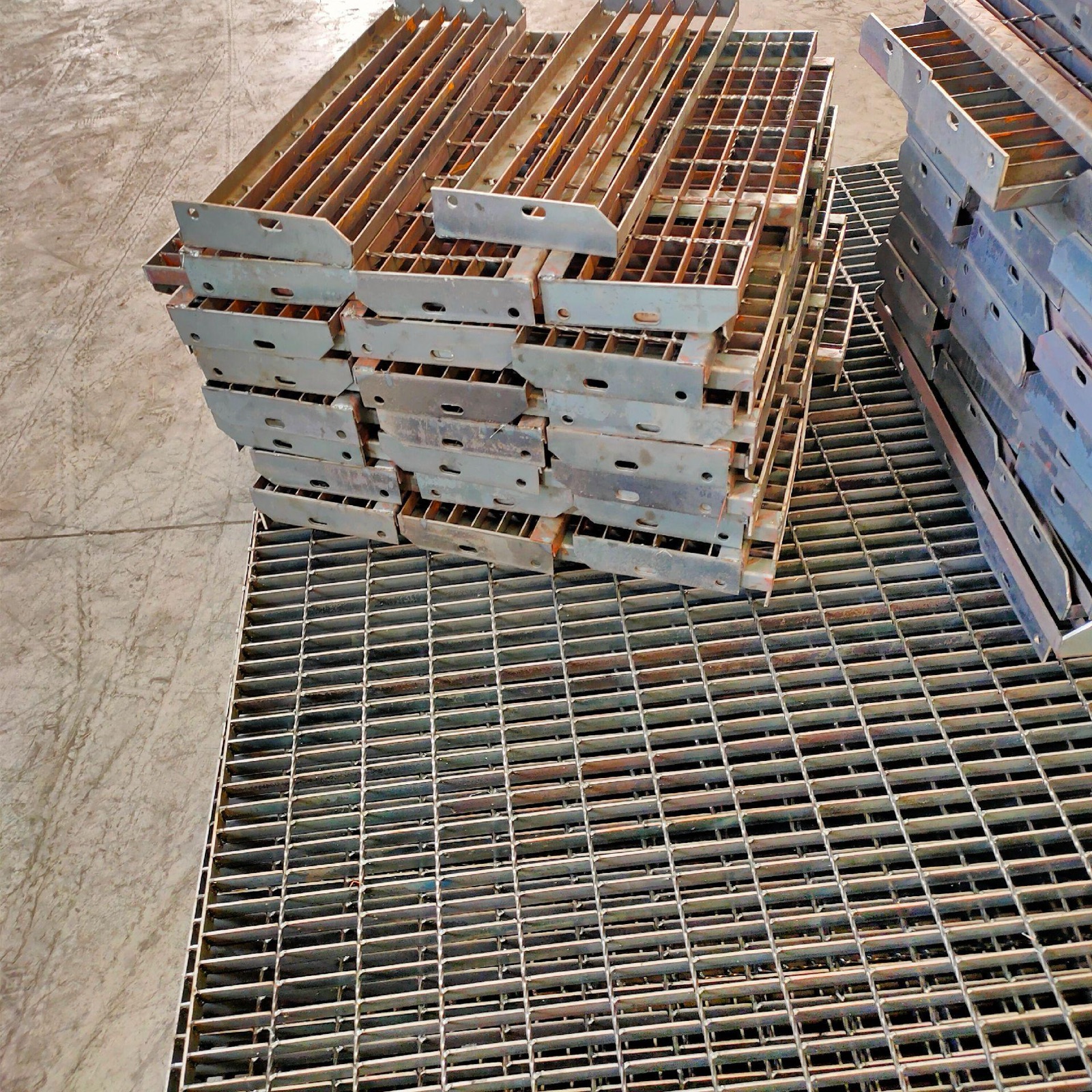 Stacked galvanized stair treads ready for packing