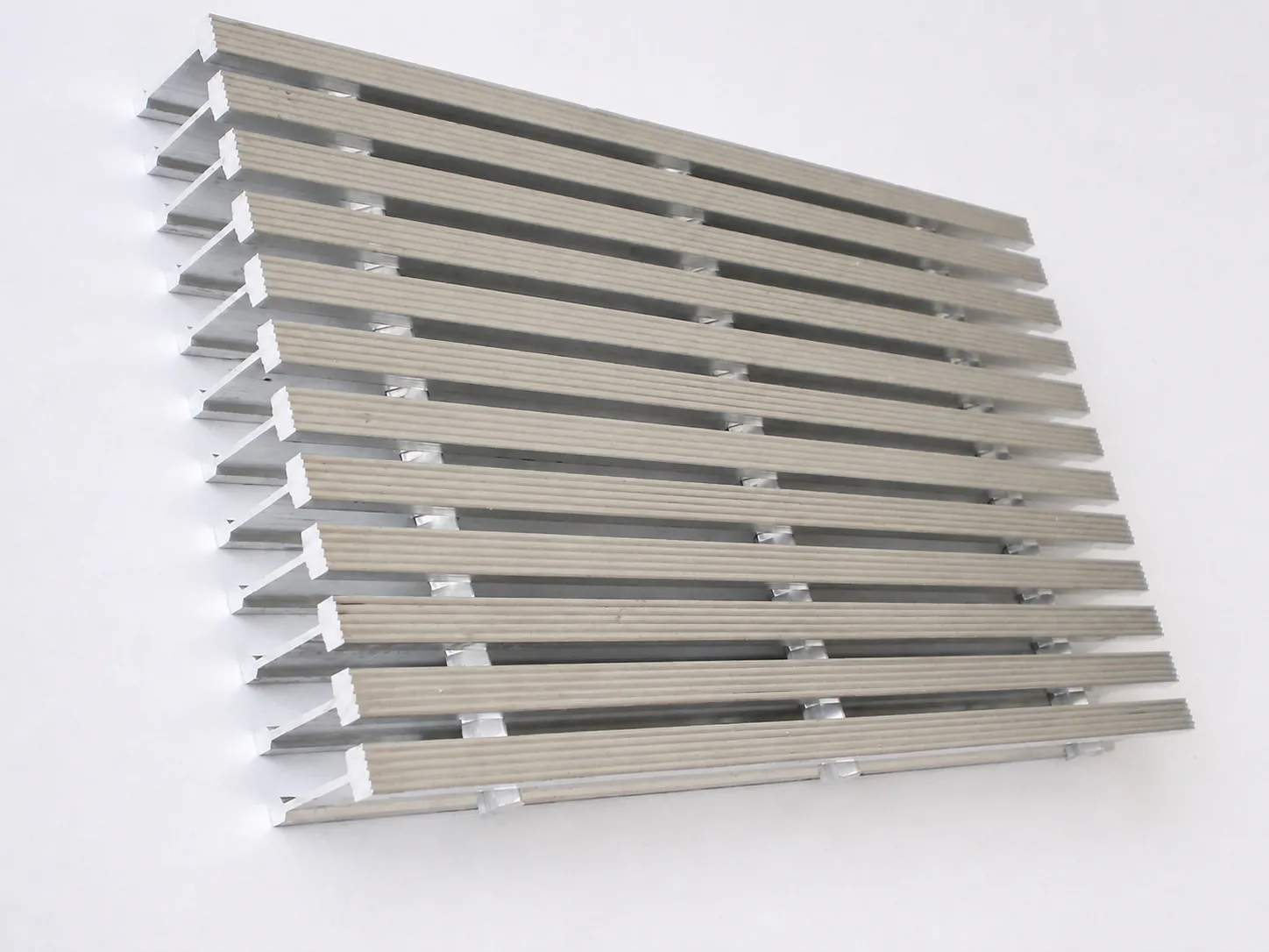 Aluminum I-bar grating panel viewed from above with profiled bearing bar surfaces