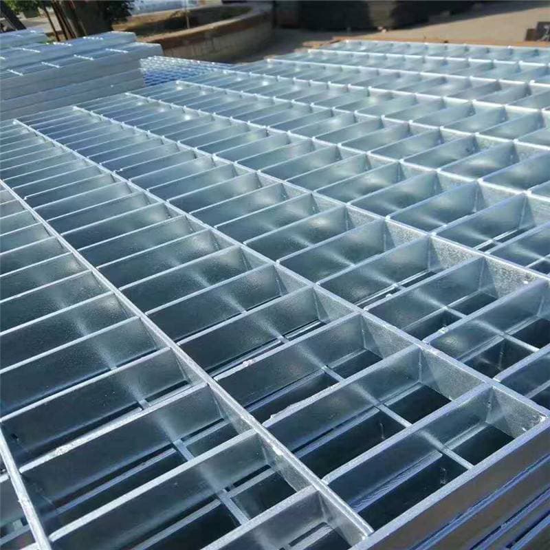 Galvanized light-profile grating panel viewed across its open grid