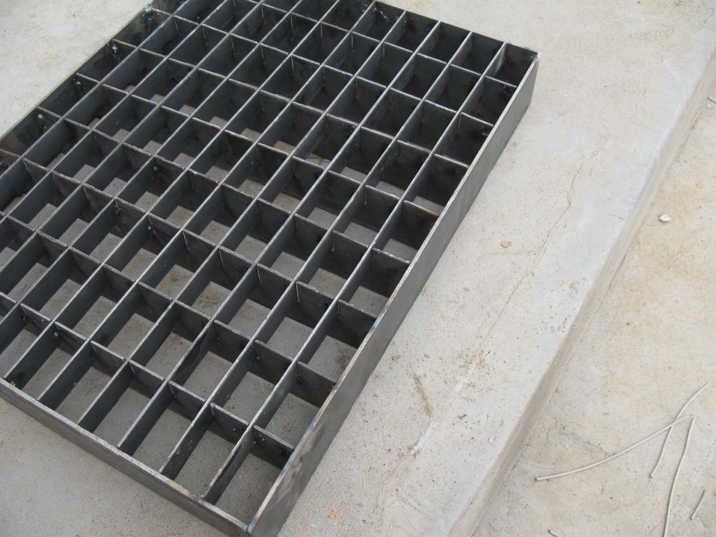 Full rectangular press-locked grating panel with an even square grid and banded edges