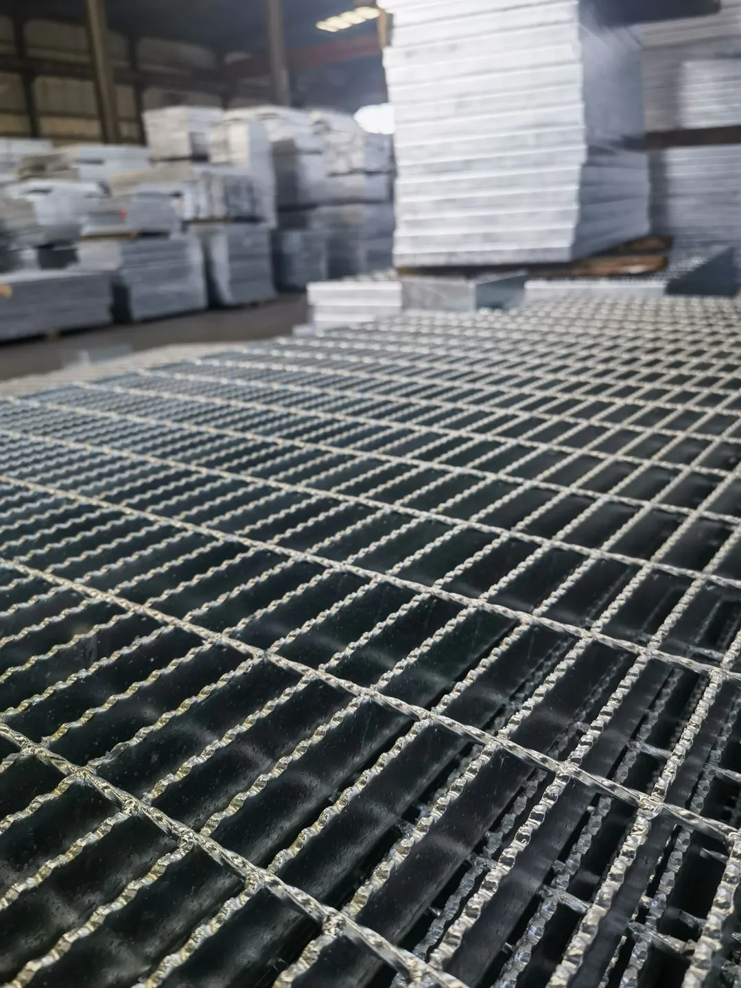 Serrated steel grating panels showing toothed bearing bars