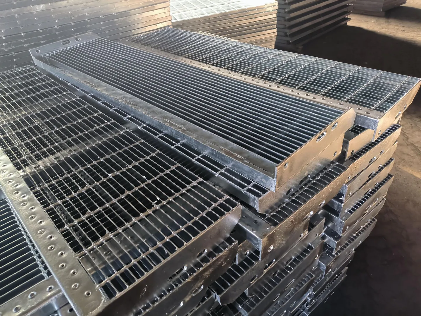Galvanized stair tread grating panels prepared for handling