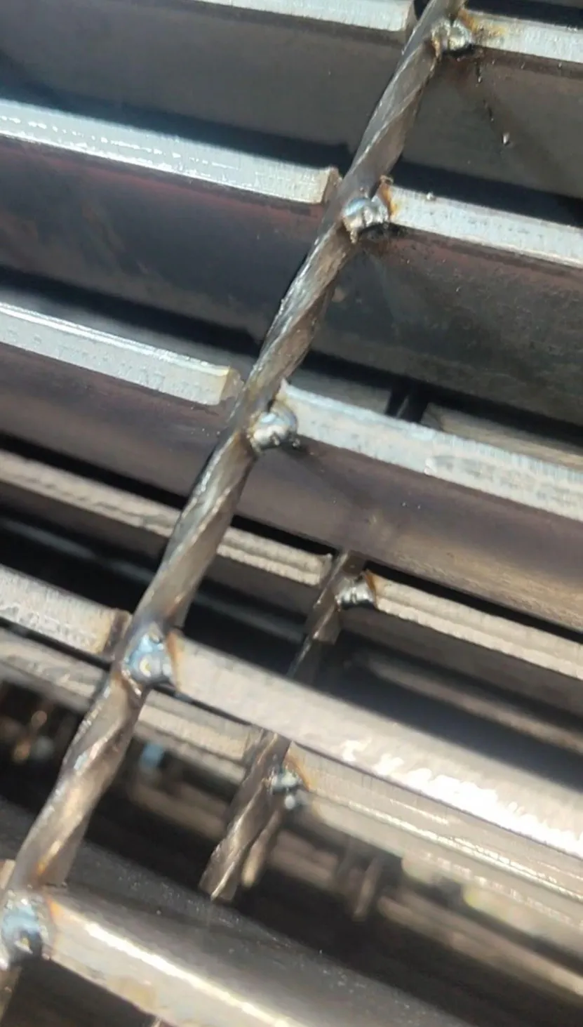 Close-up of welded intersections on a custom steel grating panel