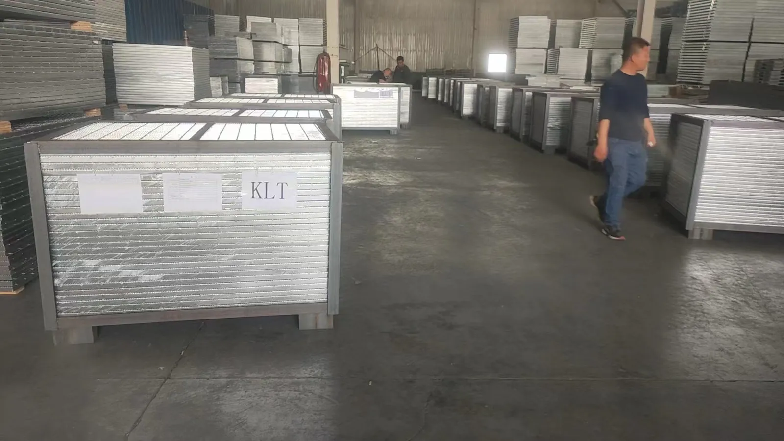 Galvanized steel grating panels packed in welded steel frames inside the workshop