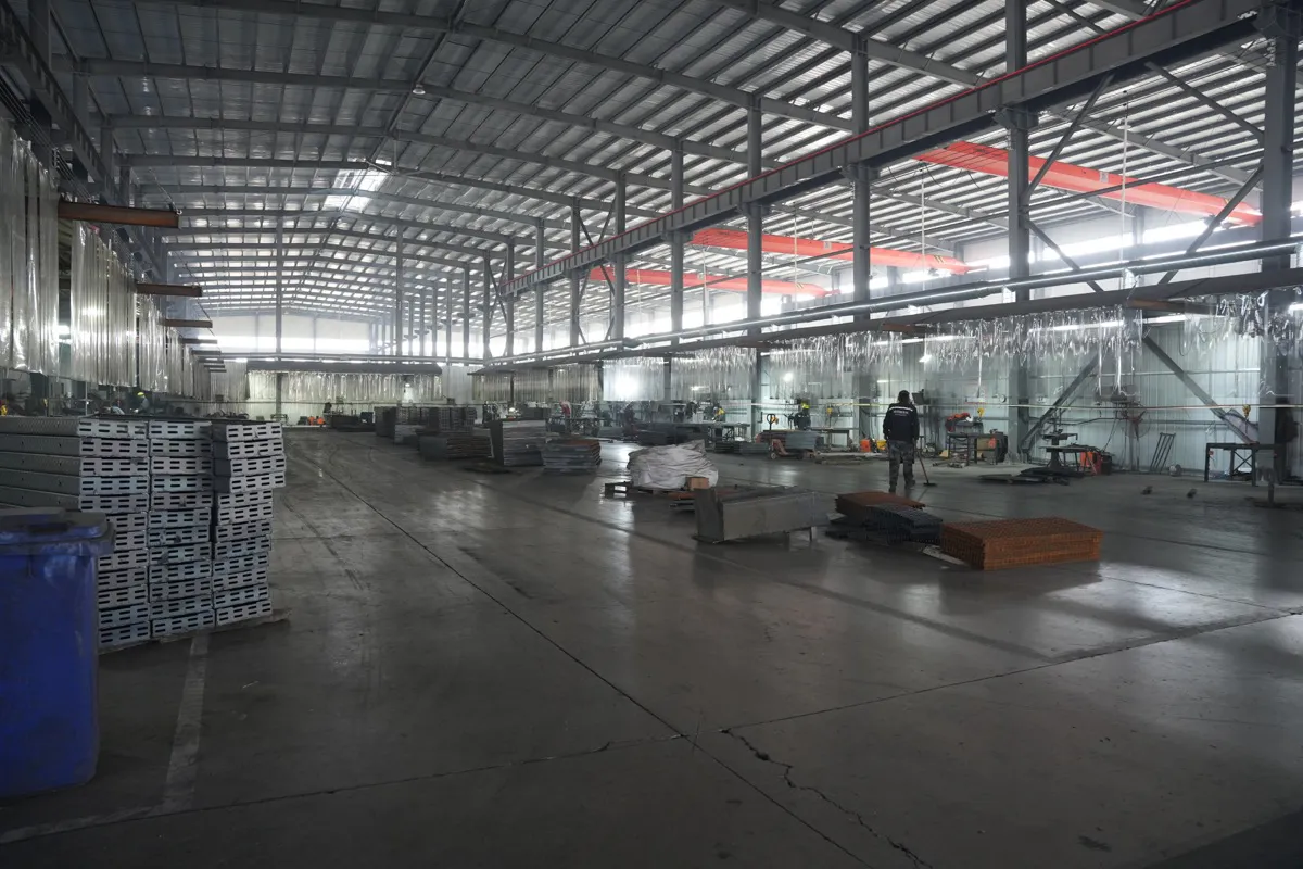 Manual welding workshop inside the DONGFU GRATING steel grating factory