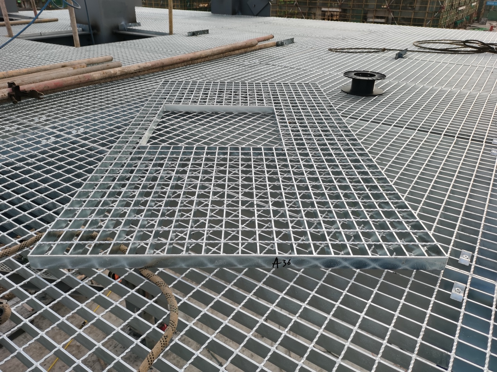 Grating panels fitted around process equipment