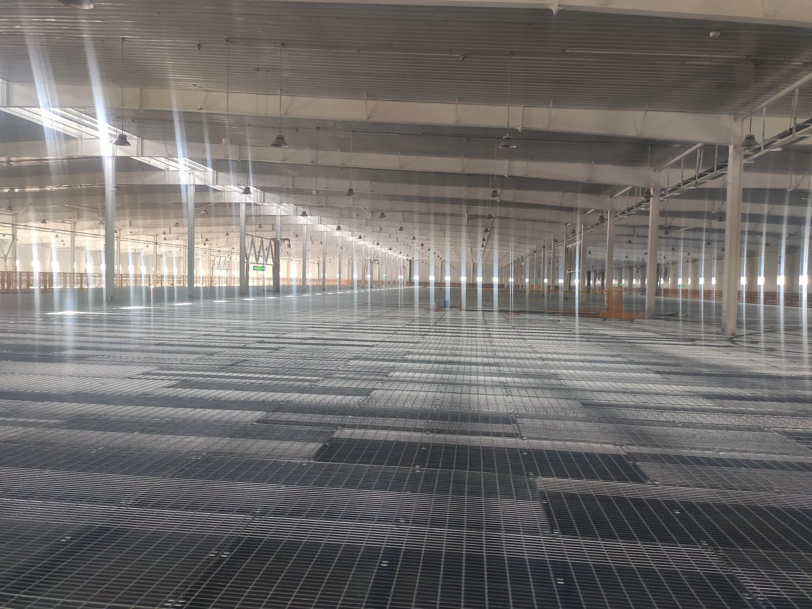 Steel grating floor installed through an automated logistics facility