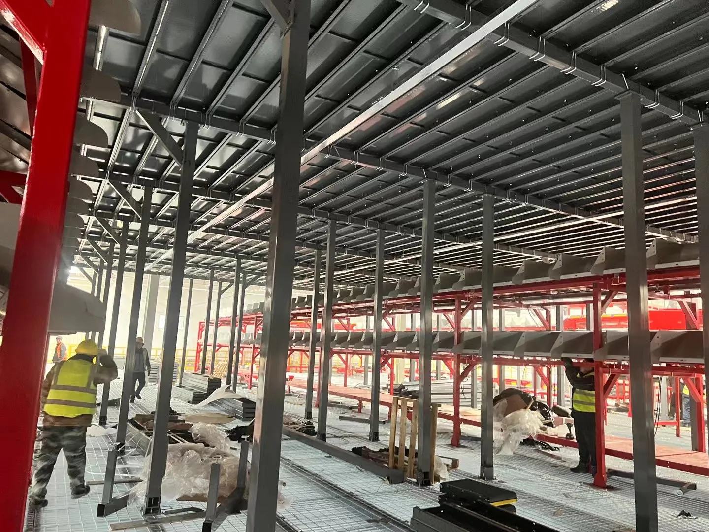Steel grating under installation around sorting equipment