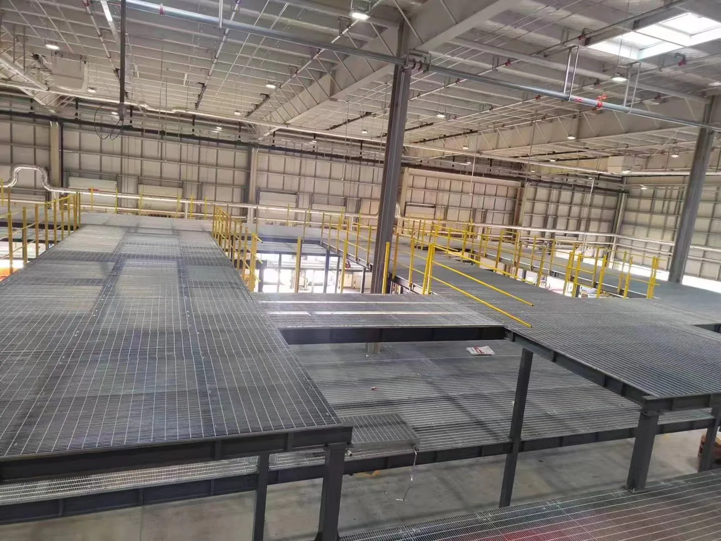 Zoned steel grating platform inside the automated logistics sorting center