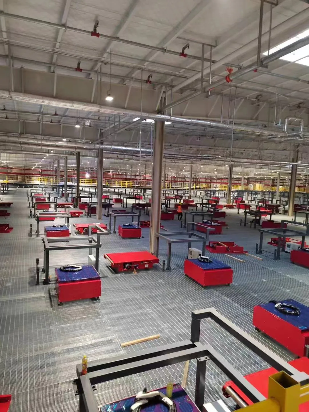 Steel grating platform installation around automated sorting equipment