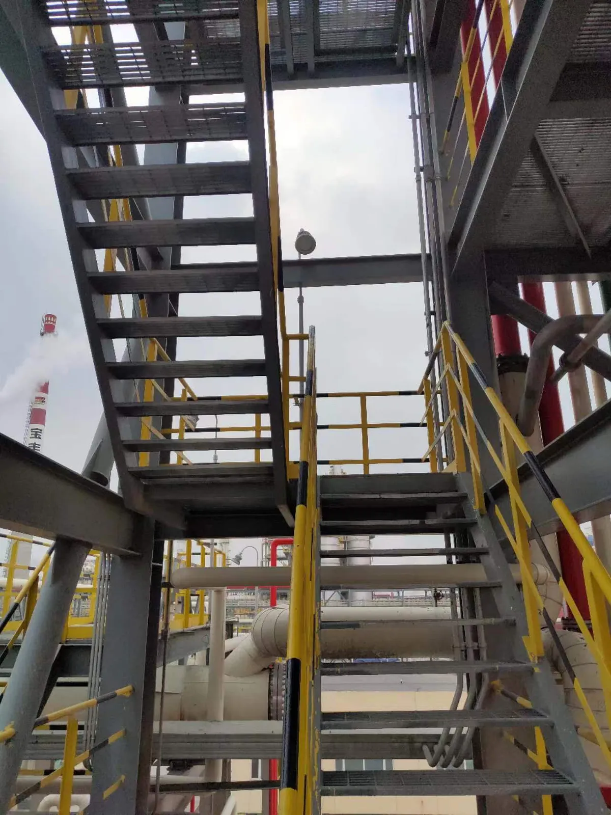 Steel grating stairs within the process tower structure