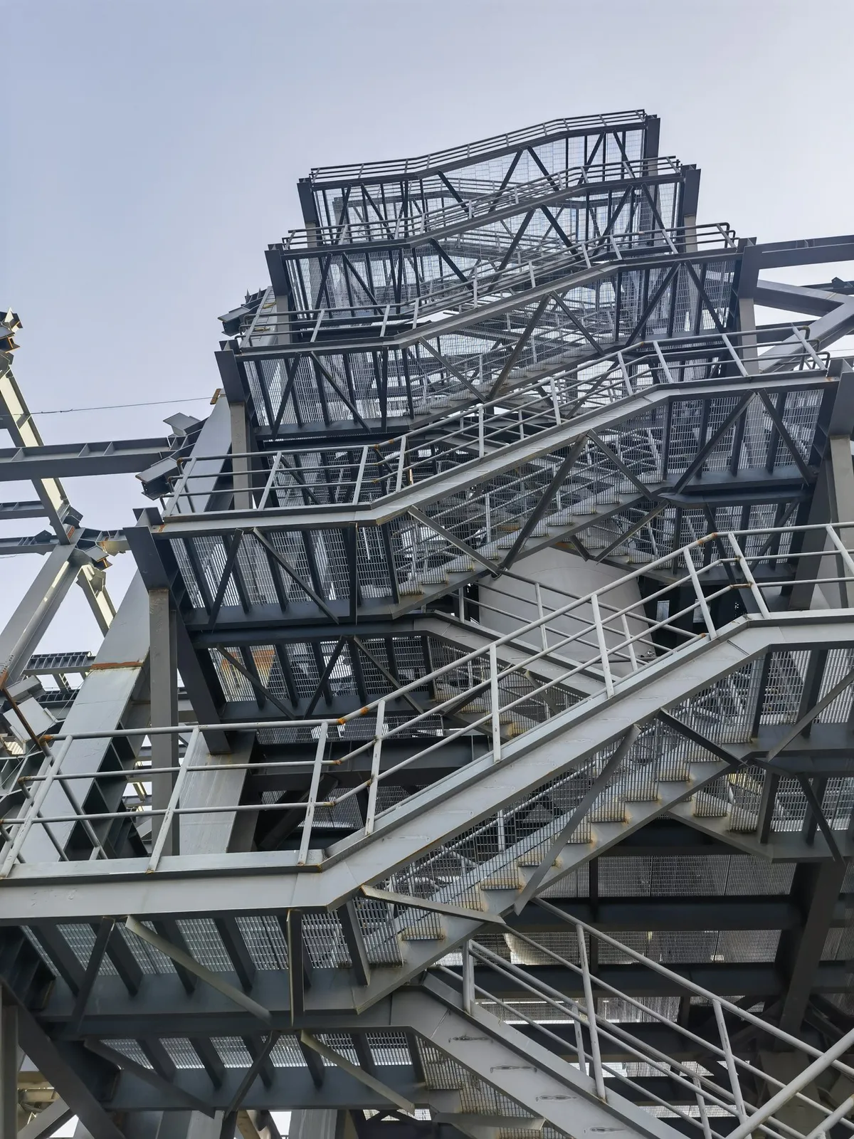 Multi-level steel grating stairs serving the chemical unit