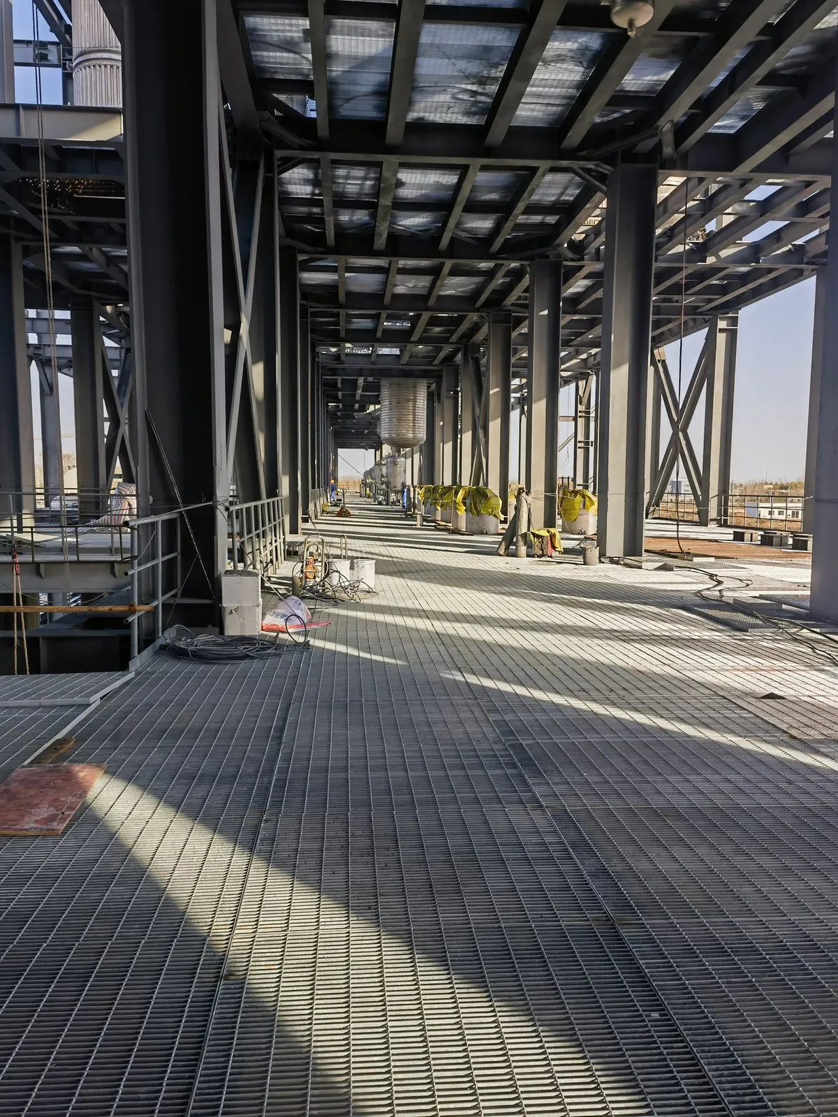 Long steel grating access route through the chemical equipment area